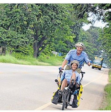 Natt Opasanon and her husband cycling a tandem bicycle across Thailand during their 2012 honeymoon, as featured in the Bangkok Post