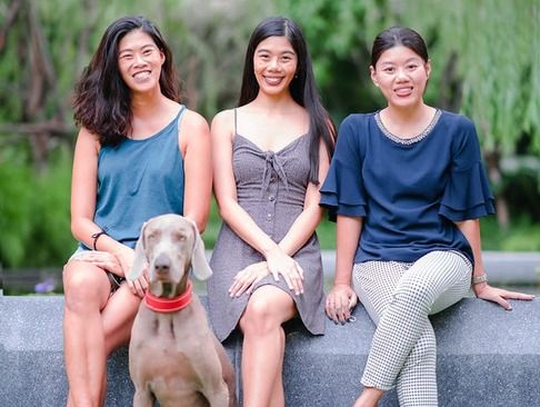Natt Hamon, née Nattaree Opasanon, with her sisters and family dog, featured in the 'Humans of Hua Hin' interview series